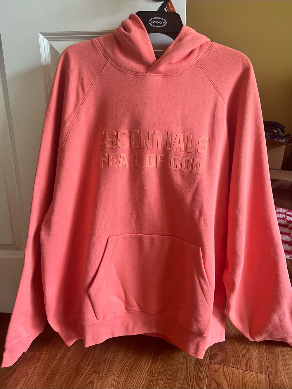 Fear of God Essentials Hoodie in Coral Pink